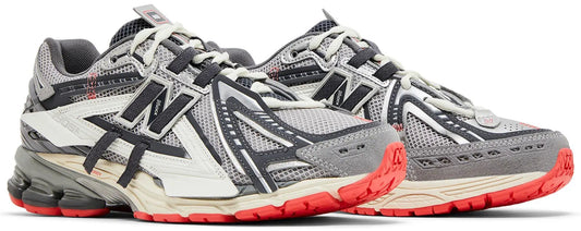 Close-up van New Balance 1906A Slate Grey Drift Red – ACTEVA LITE demping en ABZORB SBS technologie