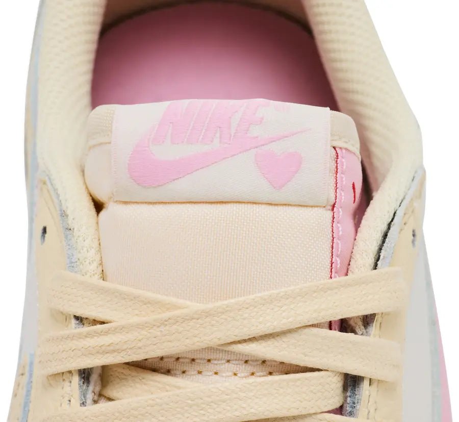 Jordan 1 Retro Low OG SP Travis Scott Shy Pink sneaker heart icon detail tongue